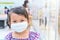 Little girl has fabric mask protect herself from Coronavirus when child go to supermarket with mother after supermarket open again