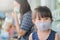 Little girl has fabric mask protect herself from Coronavirus COVID-19,hand stop sign when child leave the house,,child with a mask