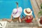 Little girl in a hat with mother in swimming pool