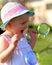 Little girl having fun with soap bubbles