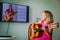 Little girl having guitar lesson online at home