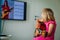 Little girl having guitar lesson online at home