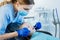 Little girl having her teeth examined by a dentist