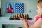 Little girl having online chess lesson, e-education, distance learning