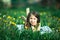 Little girl in headphones enjoying music in nature.