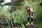 Little girl in headphones enjoying music in nature.