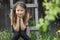 Little girl in headphones enjoying music in nature.