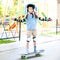 Little girl with a helmet riding on skateboard