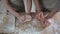 Little girl helping grandmother to roll dough for pizza, family recipe, cooking