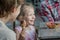 Little girl and her brother laughing during eating Italian ice cream