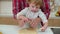 Little girl and her father cutting out cookies together