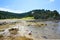 Little girl with her feet in the water. Russell Long Beach, Bay of islands. NZ