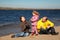 Little girl with her parents played on beach