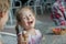 Little girl and her sibling brother laughing during eating Italian ice cream