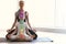 Little girl and her teacher practicing yoga