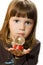 Little girl hold Santa claus figurine