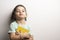 Little girl holding a book with blank cover in front of body mock-up series