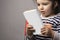 Little girl holding a book with blank cover in front of body mock-up series