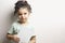 Little girl holding a book with blank cover in front of body mock-up series