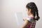 Little girl holding a book with blank cover in front of body mock-up series