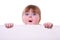 Little girl holding a cardboard looking surprised