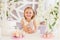 Little girl holding colorful sweet lollipops in the candy bar