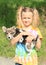 Little girl holding a dog