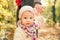 Little girl holding mothers hand. Spring toddler portrait.