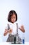 Little girl holding a test tube with liquid scientist chemistry and science