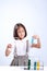 Little girl holding a test tube with liquid scientist chemistry and science