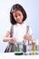 Little girl holding a test tube with liquid scientist chemistry and science