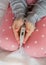 Little girl holding thermometer in hands