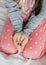 Little girl holding thermometer in hands