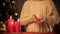 Little girl holding toy heart in arms, Christmas magic time kindness, charity