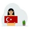 A little girl is holding a Turkish flag in his hands. Concept for demonstration, national holiday, Turkey day or