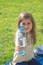 Little girl holds bottle of water