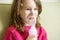 Little girl holds inhaler mask or nebulizer at home