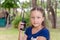 Little girl holds a walkie-talkie in her hand