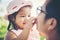 Little girl hugging neck of her daddy, Father playing with daughter happy