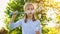 Little girl inflate soap bubbles on a picnic