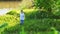 Little girl inflate soap bubbles on a picnic