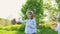 Little girl inflate soap bubbles on a picnic