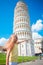 Little girl on italian vacation near the famous Leaning Tower of Pisa