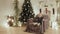 Little girl jumping in a chair for the new year on the background of Christmas decorations