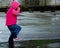 Little Girl Jumping in Puddle 3