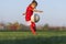 Little girl kicks soccer ball