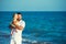 Little girl kisses her dad. Happy father playing with cute little daughter at the beach