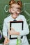 Little girl in lab coat holding digital tablet in science laboratory