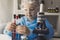 Little girl in lab coat learning chemistry in school laboratory. Young scientist in protective glasses making experiment