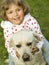 Little girl with Labrador retriever